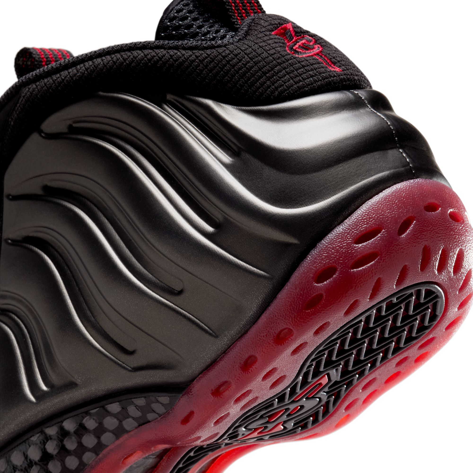 Nike Air Max "Cough Drop" Foamposite One replica sneakers showcasing a vibrant orange and black colorway, featuring a sleek design with premium materials for a high-quality look.