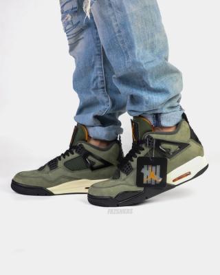 Undefeated Air Jordan 4 replica sneakers featuring a unique colorway, premium materials, and intricate detailing for sneaker enthusiasts and collectors.