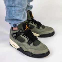 Undefeated Air Jordan 4 replica sneakers showcasing premium craftsmanship and attention to detail, featuring a distinctive colorway and stylish design elements ideal for sneaker enthusiasts.