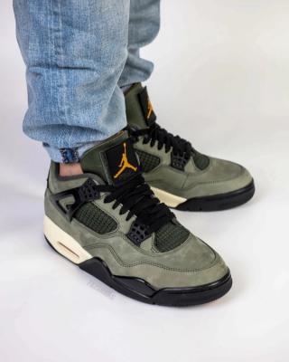 Undefeated Air Jordan 4 replica sneakers showcasing premium craftsmanship and attention to detail, featuring a distinctive colorway and stylish design elements ideal for sneaker enthusiasts.