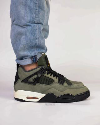 High-quality replica sneakers featuring the Undefeated Air Jordan 4 design, showcasing a combination of premium materials and iconic colorways for a stylish look.