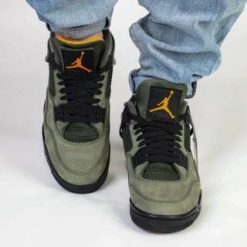 Undefeated Air Jordan 4 replica sneakers featuring a unique colorway, premium materials, and intricate design details, perfect for sneaker enthusiasts and collectors.