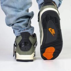 Undefeated Air Jordan 4 replica sneakers featuring a stylish design with a unique colorway and premium materials for sneaker enthusiasts and collectors.