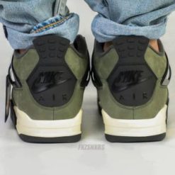 Undefeated Air Jordan 4 replica sneakers featuring a unique colorway and premium craftsmanship, perfect for sneaker enthusiasts and collectors.