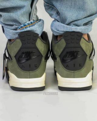 Undefeated Air Jordan 4 replica sneakers featuring a unique colorway and premium craftsmanship, perfect for sneaker enthusiasts and collectors.