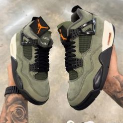 Undefeated Air Jordan 4 replica sneakers showcasing a distinct colorway and premium craftsmanship, perfect for sneaker enthusiasts seeking high-quality alternatives.