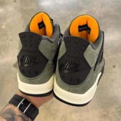 Undefeated Air Jordan 4 replica sneakers showcasing a premium design with unique colorways and high-quality materials, perfect for sneaker enthusiasts and collectors.