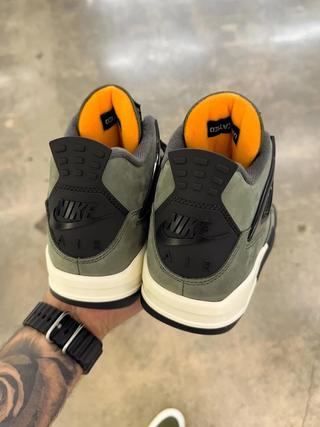 Undefeated Air Jordan 4 replica sneakers showcasing a premium design with unique colorways and high-quality materials, perfect for sneaker enthusiasts and collectors.