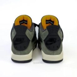 High-quality replica sneakers featuring the Undefeated Air Jordan 4 design, showcasing a stylish combination of olive green and black colorway with unique detailing.