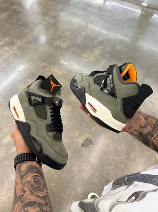 Undefeated Air Jordan 4 replica sneakers featuring a distinctive colorway and premium materials, perfect for sneaker enthusiasts and collectors.