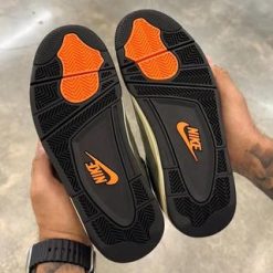 High-quality replica sneakers featuring the Undefeated Air Jordan 4 design, showcasing a stylish combination of premium materials, unique colorways, and attention to detail for sneaker enthusiasts.