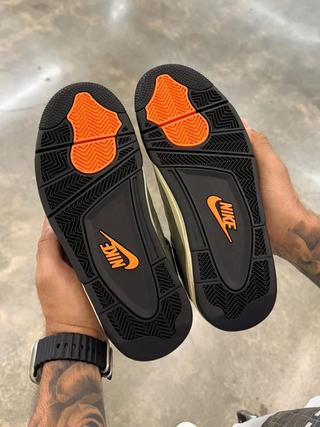 High-quality replica sneakers featuring the Undefeated Air Jordan 4 design, showcasing a stylish combination of premium materials, unique colorways, and attention to detail for sneaker enthusiasts.