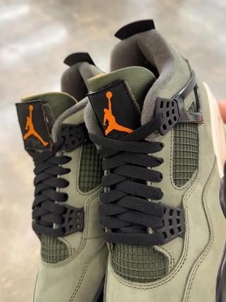 Undefeated Air Jordan 4 replica sneakers featuring a premium design and high-quality materials, perfect for sneaker enthusiasts and collectors.