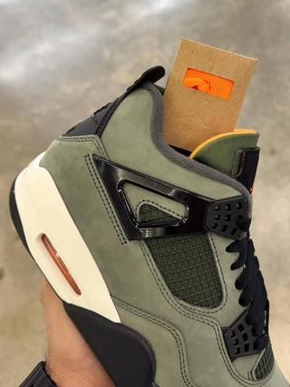 Undefeated Air Jordan 4 replica sneakers featuring a premium design with iconic colorways, perfect for sneaker enthusiasts and collectors.