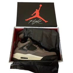 Travis Scott x Air Jordan AJ4 brown replica sneakers showcasing premium materials and a unique colorway, perfect for sneaker enthusiasts seeking high-quality alternatives.