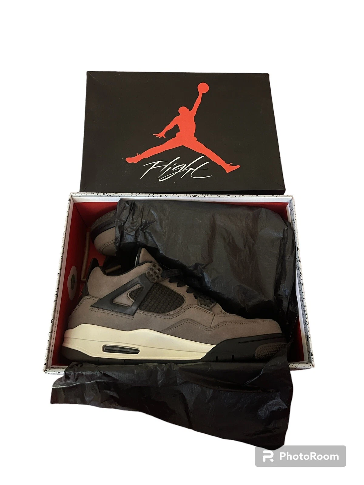 Travis Scott x Air Jordan AJ4 brown replica sneakers showcasing premium materials and a unique colorway, perfect for sneaker enthusiasts seeking high-quality alternatives.