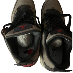 Travis Scott x Air Jordan AJ4 in brown, featuring premium materials and attention to detail, showcasing high-quality replica sneakers designed for style and comfort.