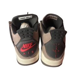 Travis Scott x Air Jordan AJ4 brown replica sneakers showcasing a stylish design with premium materials, perfect for sneaker enthusiasts and collectors.