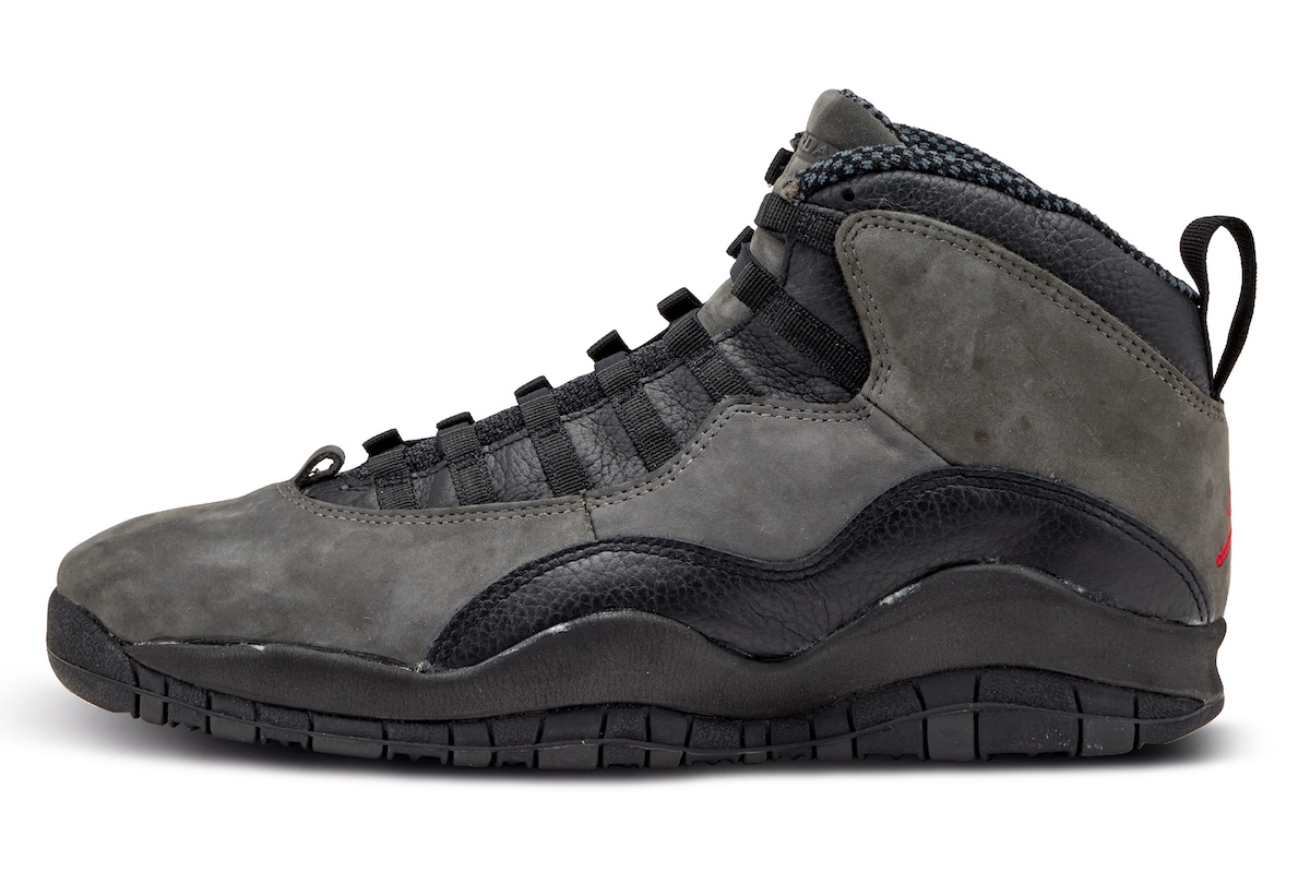 High-quality replica sneakers featuring the Air Jordan 10 Shadow design, showcasing a sleek black and grey colorway with distinctive detailing, perfect for sneaker enthusiasts.