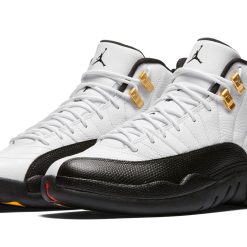 High-quality replica sneakers featuring the iconic Air Jordan 12 Taxi design, showcasing its classic black leather upper, white accents, and signature taxicab yellow detailing.