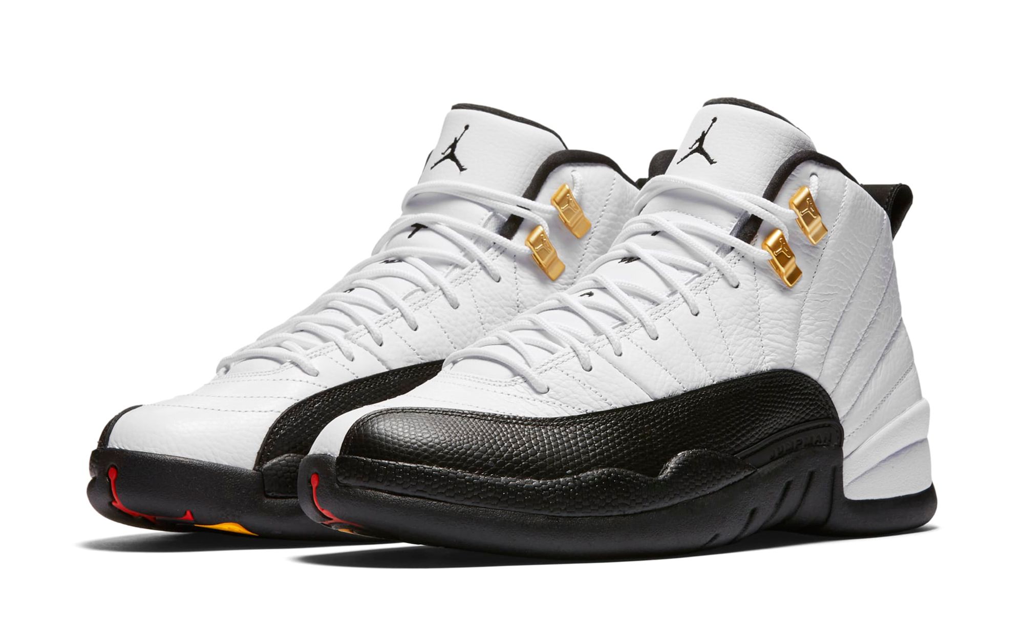 High-quality replica sneakers featuring the iconic Air Jordan 12 Taxi design, showcasing its classic black leather upper, white accents, and signature taxicab yellow detailing.