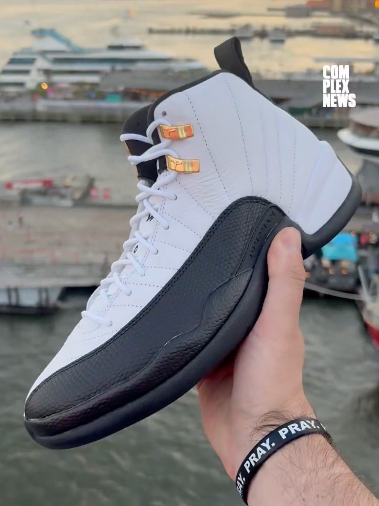 Air Jordan 12 Taxi 2025 CT8013 117 high-quality replica sneakers showcasing a classic black, white, and taxi yellow colorway, featuring premium materials and attention to detail, perfect for sneaker enthusiasts.