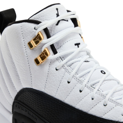 Air Jordan 12 Taxi replica sneakers showcasing a high-quality design with classic black and white colorway, featuring the iconic golden accents and textured upper, perfect for sneaker enthusiasts and collectors.