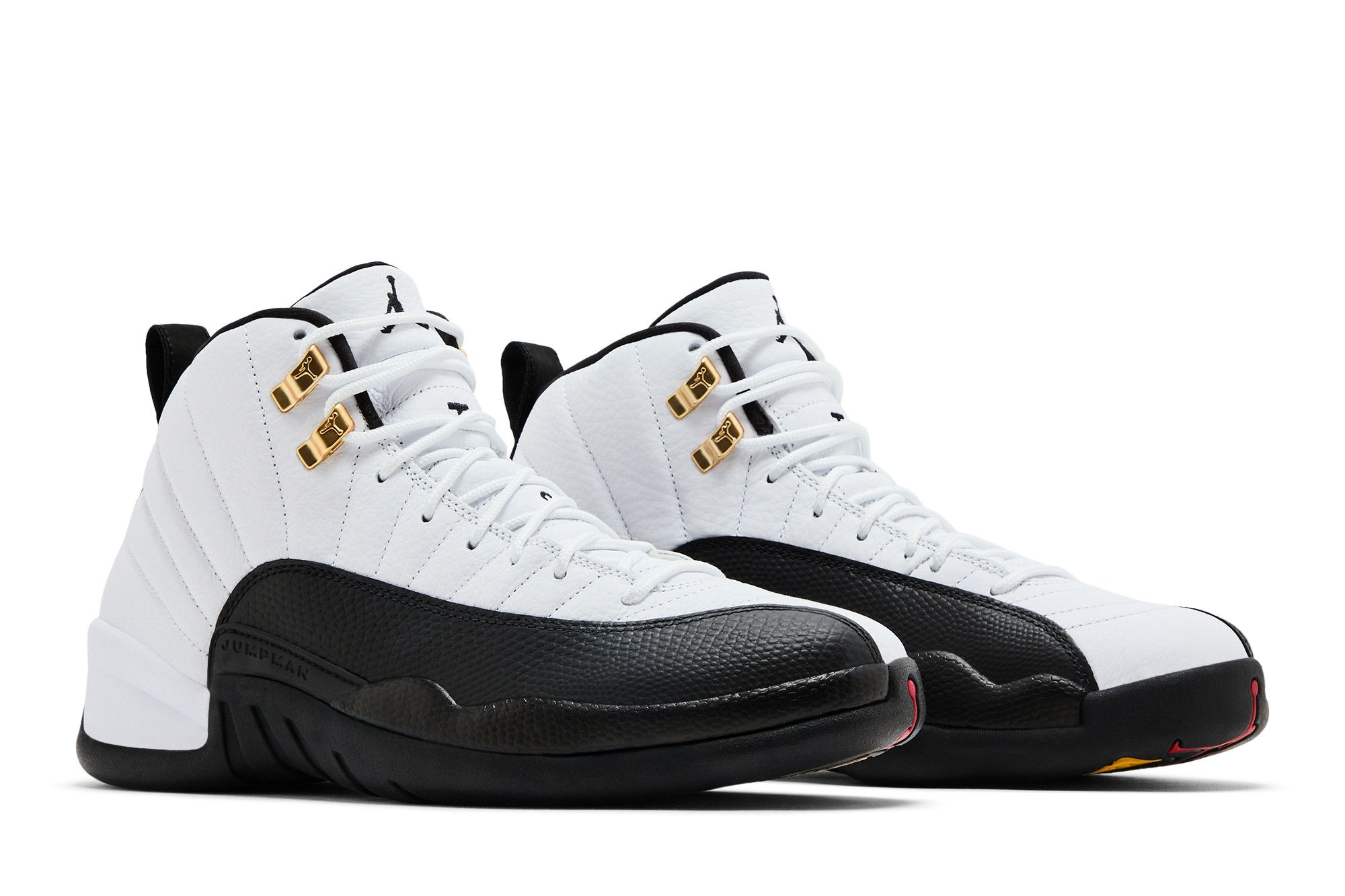 Air Jordan 12 Taxi replica sneakers featuring a classic black and white colorway with hints of yellow, showcasing premium materials and attention to detail for sneaker enthusiasts.
