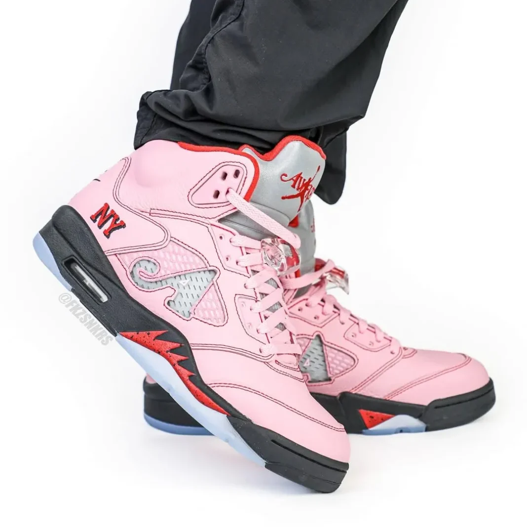 Awake NY Air Jordan 5 Arctic Pink replica sneakers featuring a stylish design with a soft pink upper, classic silhouette, and unique branding details, perfect for sneaker enthusiasts and collectors.