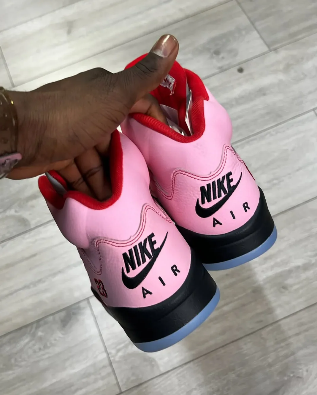 Awake Ny Air Jordan 5 Pink replica sneakers featuring a vibrant pink colorway with premium detailing, perfect for sneaker enthusiasts looking for high-quality replicas.