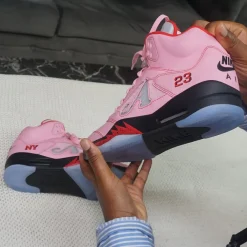 Awake NY Air Jordan 5 Pink replica sneakers featuring a vibrant pink and white colorway, showcasing the iconic silhouette and quality craftsmanship expected from premium replica footwear.