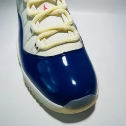 2025 Air Jordan 11 “Rare Air” replica sneakers with a sleek black upper, white midsole, and signature patent leather detailing, perfect for sneaker enthusiasts seeking high-quality replicas.