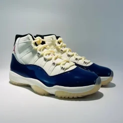 Air Jordan 11 “Rare Air” high-quality replica sneakers featuring a sleek black and white design with iconic patent leather and mesh upper, perfect for sneaker enthusiasts and collectors.